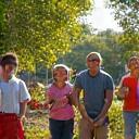 Community members working together on a local park clean-up and planting event.
